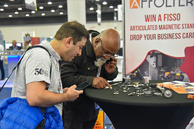 Inspecting-Parts-at-MPT-Expo